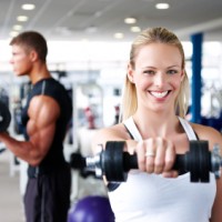 Young Adults Lifting Weights at the Gym